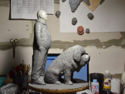 Polymer clay statues with a dog